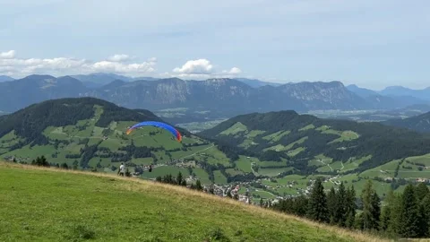 Paragliders Hovering and Taking Off Over Mountain Scenery Video stock 316218155