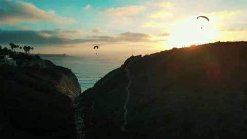 Paragliders over cliffs and Ocean Stock Footage 169418981