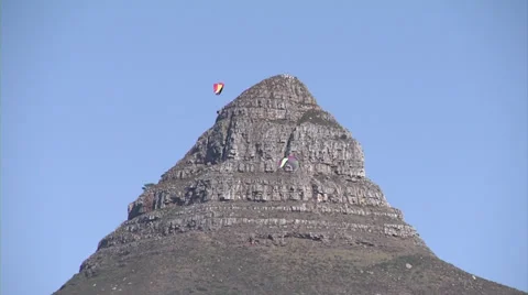 Paragliders pass in front of Lion's Head, Cape Town Stock Footage 37758611