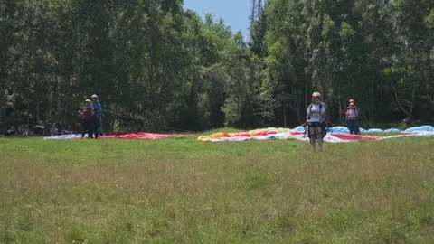Paragliders Prepare and Wait for Ideal Wind Conditions Stock Footage 304563903