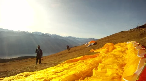Paragliders preparing to paraglide. 動画素材 67986523