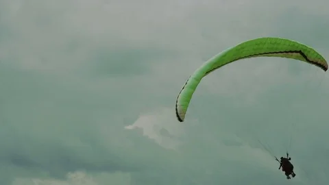 Paragliders soar in air currents Stock Footage 84548687