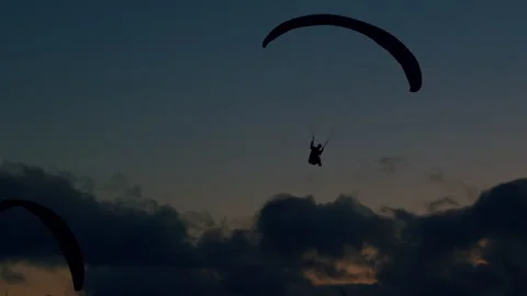 Paragliders at sunset_1 Stock Footage 299907204