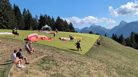 Paragliders taking off from Col de la Forclaz, Annecy, France, 6 August 2026 Stock Footage 342448714