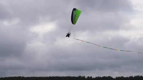 Paragliding against cloudy sky Video stock 55813296