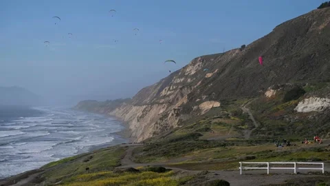 Paragliding along the coast Stock Footage 164130236