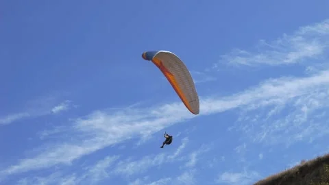 Paragliding on the background of blue sky. Live a healthy life. Be H3althy Stock Footage 252145864