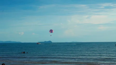 Paragliding on the beach far view 動画素材 300690699
