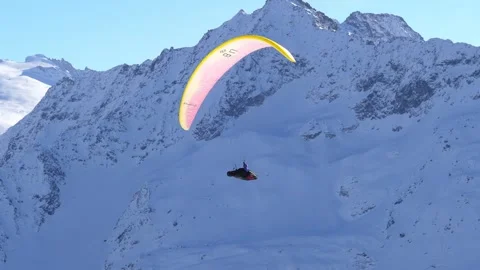 Paragliding in a beautiful winter landscape. Stockbeeldmateriaal 296737663