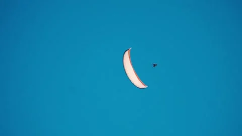Paragliding in the blue sky during summer day at Manali, Himachal Pradesh, India Stock Footage 334107905