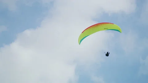 Paragliding on a cloudy sky Stock Footage 219023124