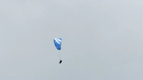 Paragliding in a cloudy sky over Chamonix Stock Footage 158821033