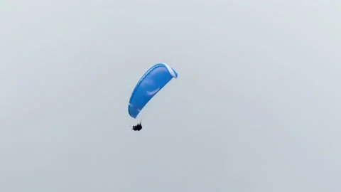 Paragliding in a cloudy sky over Chamonix Stock Footage 158821052