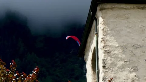 Paragliding in a cloudy sky over Chamonix Stock Footage 158821057