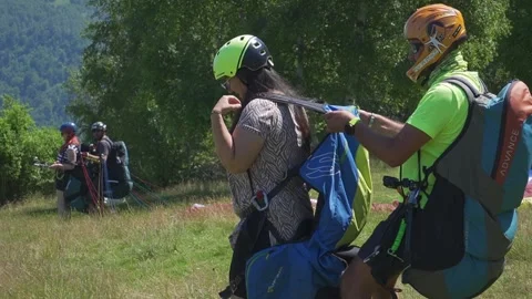 Paragliding Duo Tests Push-Start Before Takeoff Stock Footage 304578023