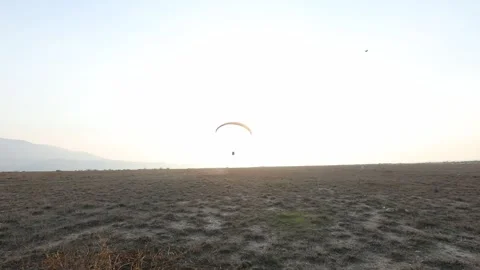 Paragliding in the field 1 動画素材 309554377