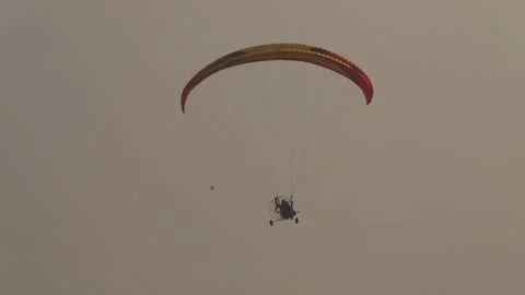 Paragliding in the field 13 Stock Footage 309555601