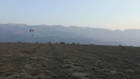 Paragliding in the field 4 Video stock 309554450
