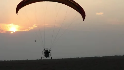 Paragliding in the field 9 Stock Footage 309554583