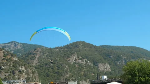 Paragliding fly with ropes by beach. Stock Footage 233742518