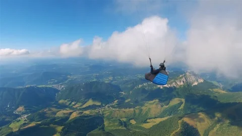 Paragliding flying in clouds sky in alps mountains landscape freedom adrenaline 스톡 동영상 293709341