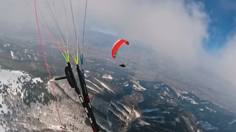 Paragliding flying in clouds winter mountains nature, Freedom action adrenaline Stock Footage 171625272