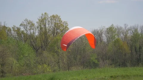 Paragliding Flying Landing Cloudy Stock Footage 111411776