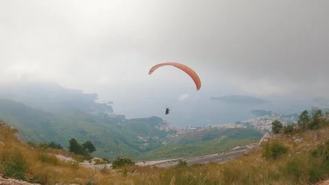 Paragliding in fog Stock Footage 256709720