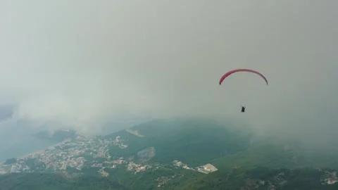 Paragliding in fog Stock Footage 256709831