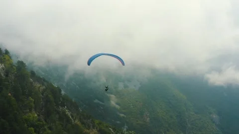 Paragliding in fog Stock Footage 256710079