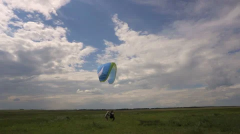 Paragliding Instructor and Student. Training on the Ground With Open Wings. Stock-Footage 64769473