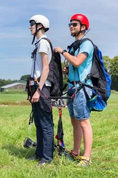 Paragliding instructor with boy  for tandem flight Stock Photos