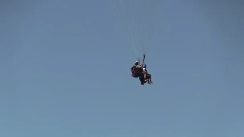 Paragliding with an instructor Stock Footage 145733395