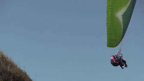 Paragliding with an instructor Stock Footage 145733398
