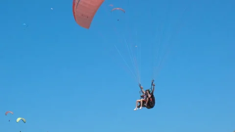 Paragliding with instructor on shore. Stock Footage 240667495