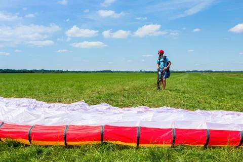 Paragliding instructor waiting with parachute Stock Photos