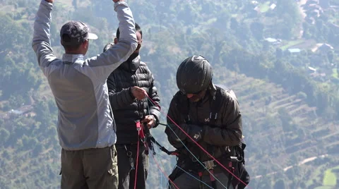Paragliding instructors discuss thermals at launch site in Pokhara, Nepal Stock-Footage 48790124