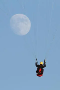Paragliding with the moon Stock Photos