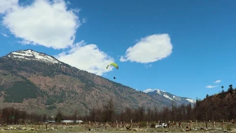Paragliding with mountain view and bright sky at morning from different angle Video stock 244697516