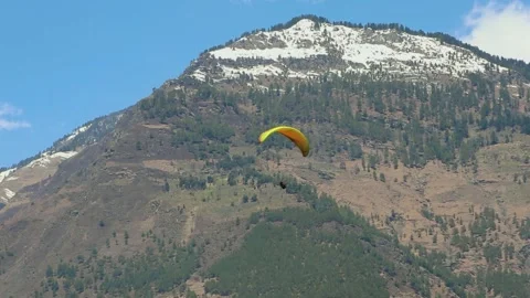 Paragliding with mountain view and bright sky at morning from different angle 스톡 동영상 244697535