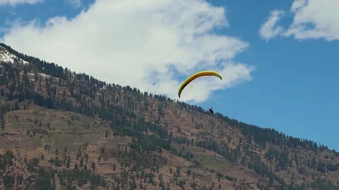 Paragliding with mountain view and bright sky at morning from different angle Stock Footage 244697550