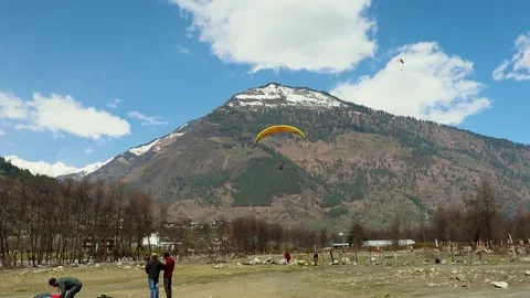 Paragliding with mountain view and bright sky at morning from different angle Stock Footage 244697590