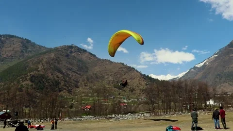 Paragliding with mountain view and bright sky at morning from different angle Stock Footage 244697646