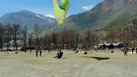Paragliding with mountain view and bright sky at morning from different Stock-Footage 244825659