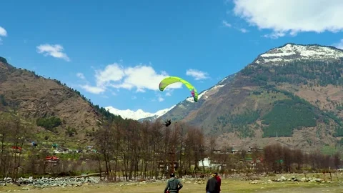 Paragliding with mountain view and bright sky at morning from different Video stock 244825663