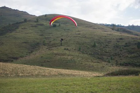 Paragliding in mountains Stock Photos