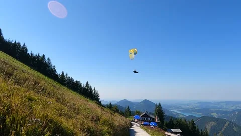 Paragliding with mountains view 動画素材 163445812