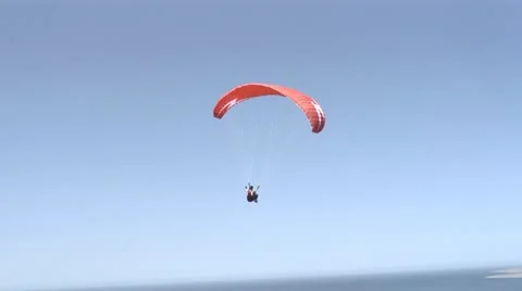 Paragliding over the ocean Stock Footage 22102828