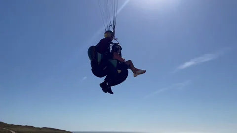 Paragliding Passenger Low Flight Handheld Shot Video stock 249333207