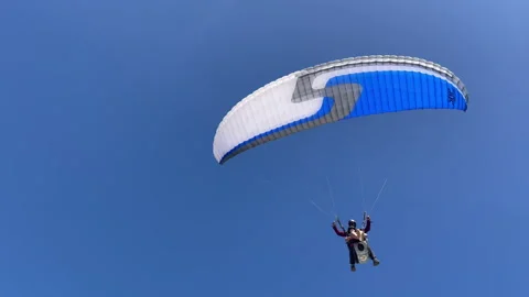 Paragliding Passenger Low Flight Over Sea Handheld Shot Video stock 249660689
